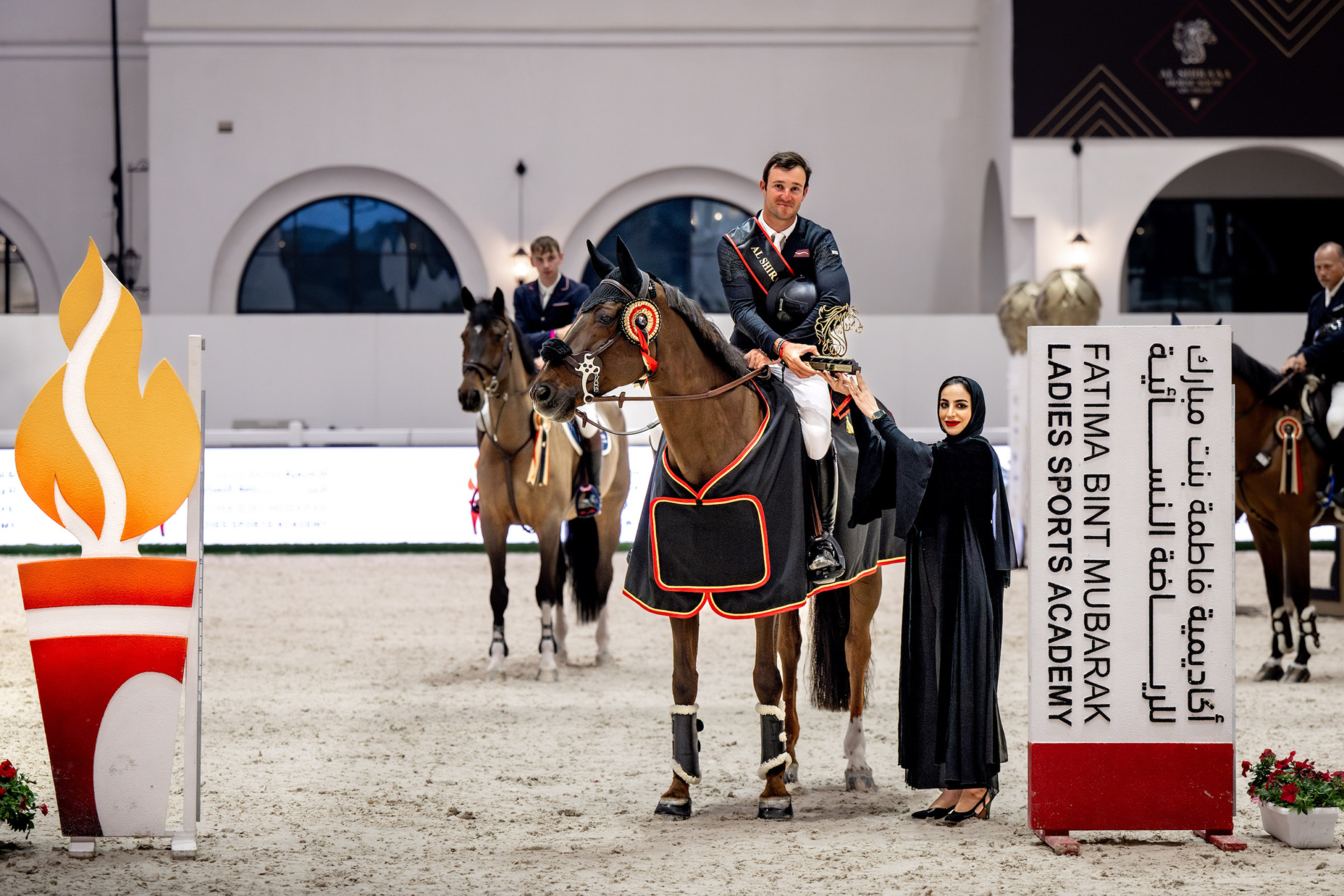 Constant van Paesschen, winner of the FMBA CSI3* 1.45cm and Ms Shamsa Saif Alhanaee, Board Member of FBMA.